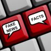 Keyboard showing fake news and facts as keys