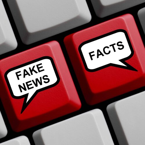  Keyboard showing fake news and facts as keys 