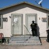 Maricopa County constable Darlene Martinez knocks on a door before posting an eviction order. The CDC eviction moratorium expires June 30, 2021.