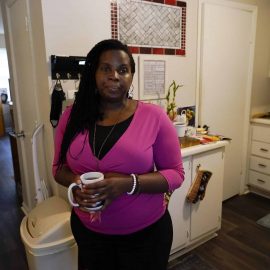Dylyn Price of Athens, Ga., looks out a doorway from her kitchen at her rented townhome.